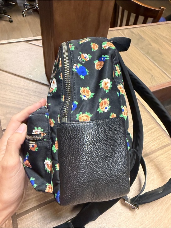 coach blue floral backpack Court with Lovely Butterfly Print, Midnight Navy Multi Fashion Signature coated canvas and smooth leather Inside zip cell phone and multifunction pockets Laptop compartment with zip closure Zip closure recycled polyester lining Top handle with 3 drop Outside zip pocket Luggage sleeve Adjustable shoulder straps Fits a 16 laptop 11 3/4 (L) x 16 1/2 (H) x 6 (W) Style No. Coach Men's Hudson Backpack In
